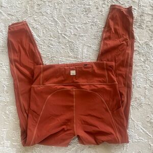 Vuori orange workout leggings